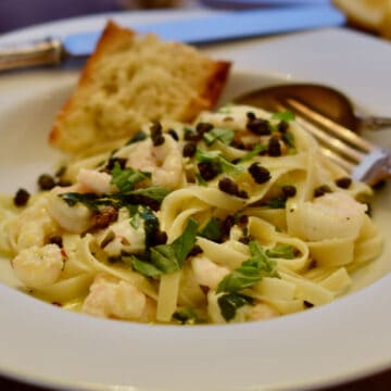 A bowl of Lemony Pasta with Shrimp and Fried Capers.