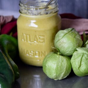 A jar of homemade fresh green enchilada sauce.