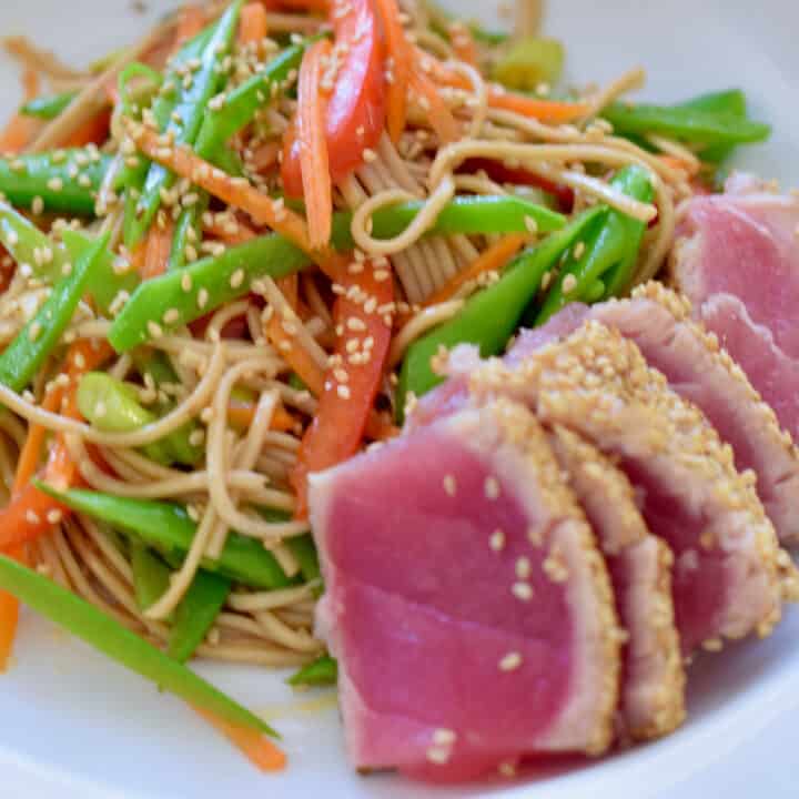 Sliced rare ahi tuna with soba noodle Asian style salad.