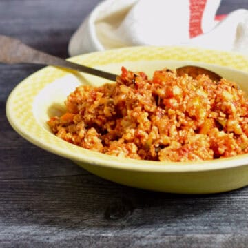 Mexican (Spanish) Style Cauliflower rice witha spoon for serving.