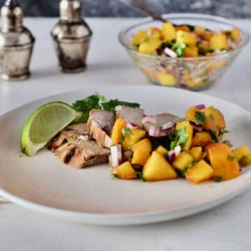 Pork with peach salsa on top.